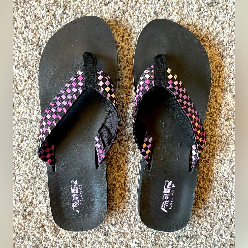 Air Balance size 11 flip flops. Black with purple checkered design.